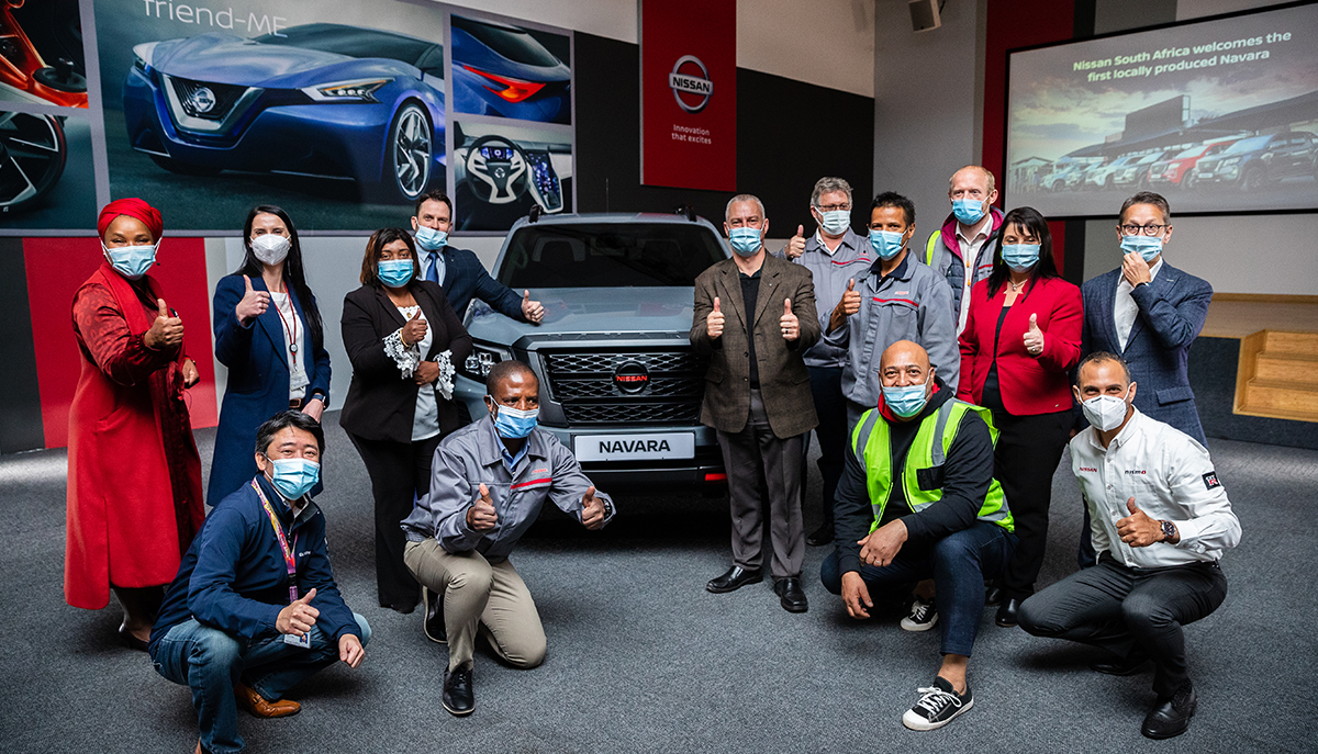 Nissan team in front of Navara